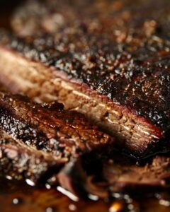 "Expert pit boss preparing the best smoked brisket recipe, showcasing juicy slices."